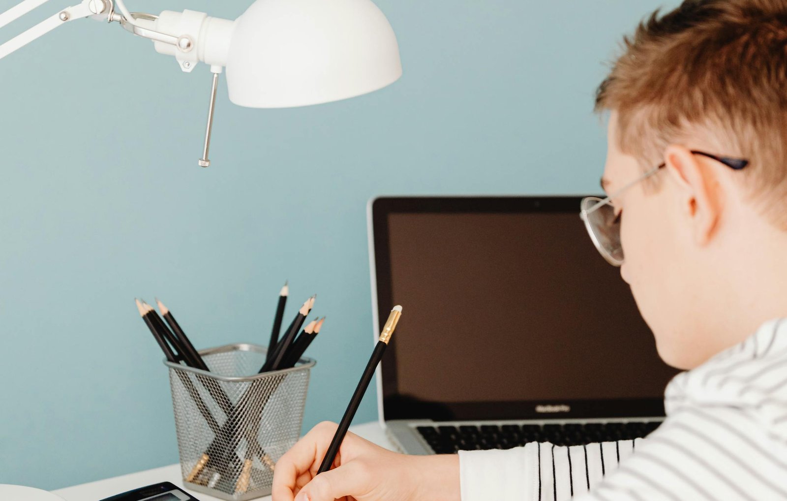 An author working at a desk during manuscript development